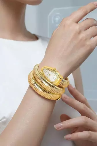 Elegant serpent-style gold-plated wraparound tubogas watch bracelet for women