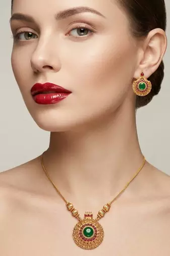 Handcrafted ethnic gold-plated necklace set with green emerald-style stones & ruby accents - traditional bridal jewelry