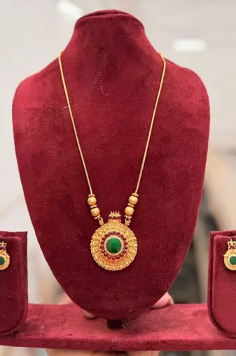 Handcrafted ethnic gold-plated necklace set with green emerald-style stones & ruby accents - traditional bridal jewelry