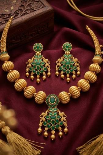Traditional green stone necklace set with matching earrings
