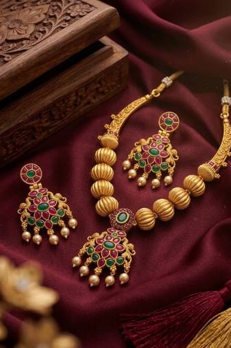 Traditional green stone necklace set with matching earrings