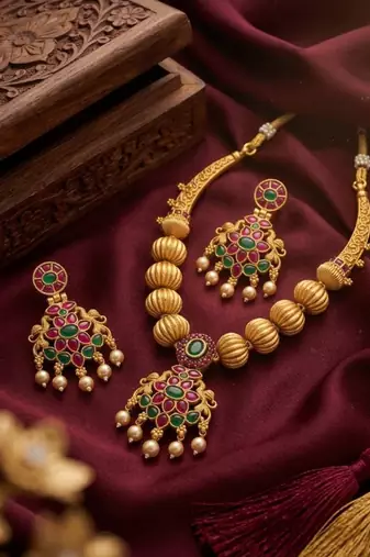Traditional green stone necklace set with matching earrings