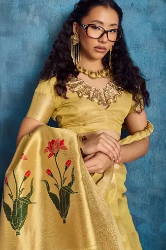 Yellow color luxurious zari tissue saree  classic ethnic collection