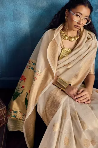 Cream luxurious zari tissue saree  classic ethnic collection