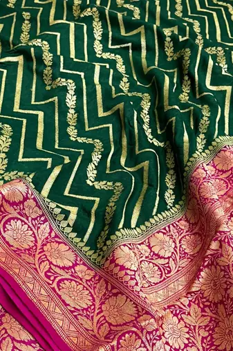 Banarasi puresilk munga saree in bottle green colour with floral zari work