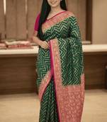 Banarasi puresilk munga saree in bottle green colour with floral zari work
