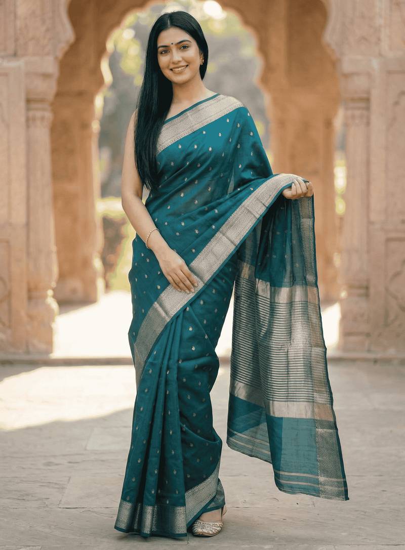 Banarasi puresilk chiniya saree in bottle green colour with zari booti work