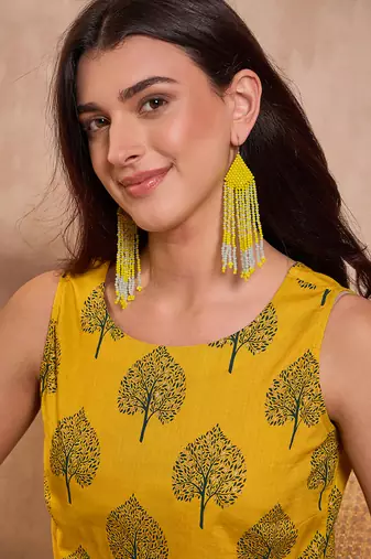 mustard cotton blend tree print sleeveless top
