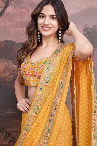 Yellow georgette embriodered lace saree with blouse piece.