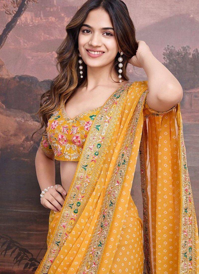 Yellow georgette embriodered lace saree with blouse piece.