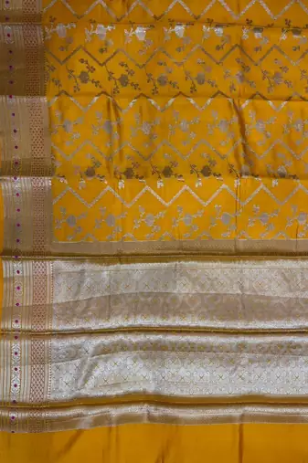 Banarasi  pure silk chiniya saree in mustard colour with floral  zari zig-zag pattern with red colour meenakari