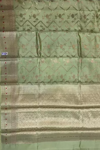 Banarasi  pure silk chiniya saree in pista green colour with floral  zari zig-zag pattern with red colour meenakari