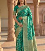 Banarasi  pure silk chiniya saree in teal green colour with floral  zari zig-zag pattern with red colour meenakari