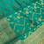Banarasi  pure silk chiniya saree in teal green colour with floral  zari zig-zag pattern with red colour meenakari