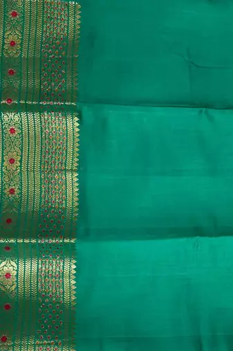Banarasi  pure silk chiniya saree in teal green colour with floral  zari zig-zag pattern with red colour meenakari