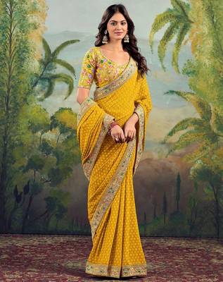 Yellow georgette embriodered lace saree with blouse piece. 3