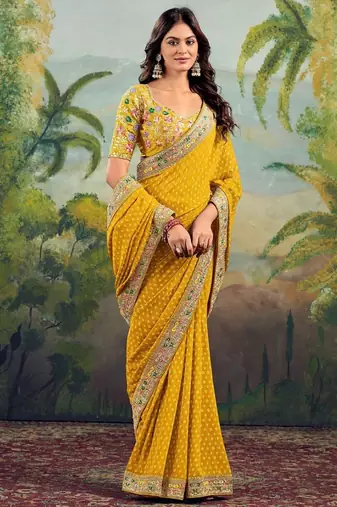 Yellow georgette embriodered lace saree with blouse piece.