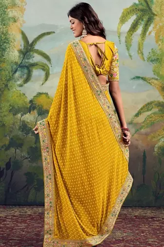 Yellow georgette embriodered lace saree with blouse piece.