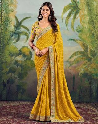 Yellow georgette embriodered lace saree with blouse piece. 1