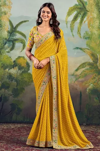 Yellow georgette embriodered lace saree with blouse piece.
