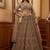 Grand Beige Zari Embroidery Net Sangeet Wear Lehenga Choli With Dupatta