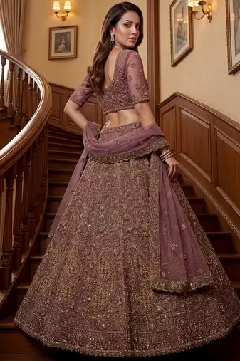 Luxurious Mauve Dori Work Net Reception Wear Lehenga With Blouse
