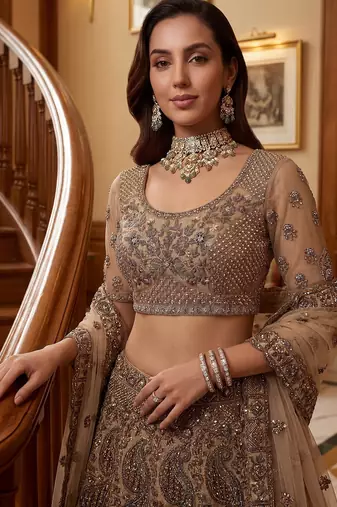 Grand Beige Zari Embroidery Net Sangeet Wear Lehenga Choli With Dupatta