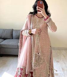 Charming light peach silk suit with intricate floral embroidery
