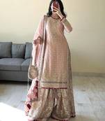 Charming light peach silk suit with intricate floral embroidery