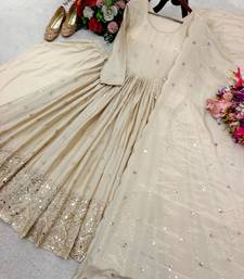 Dark beige gold anarkali gown with heavy sequin hem