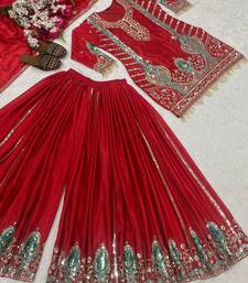 Red embroidered suit with mint green contrasts