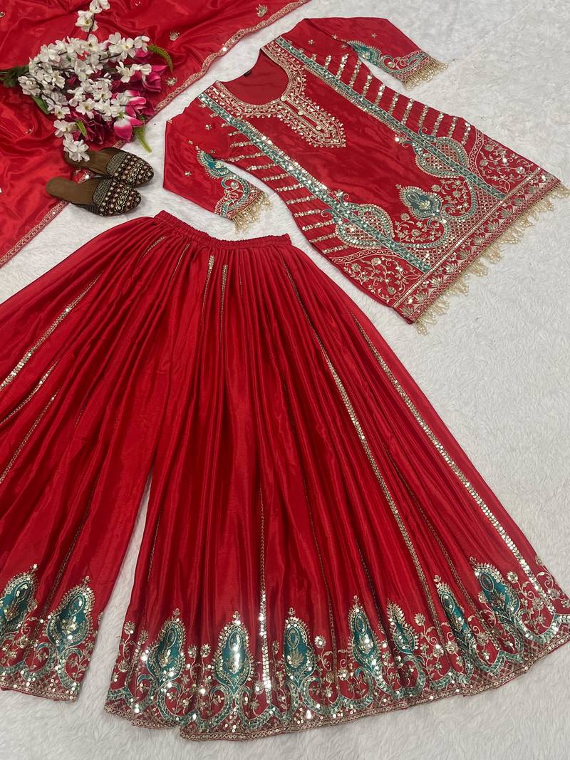 Red embroidered suit with mint green contrasts