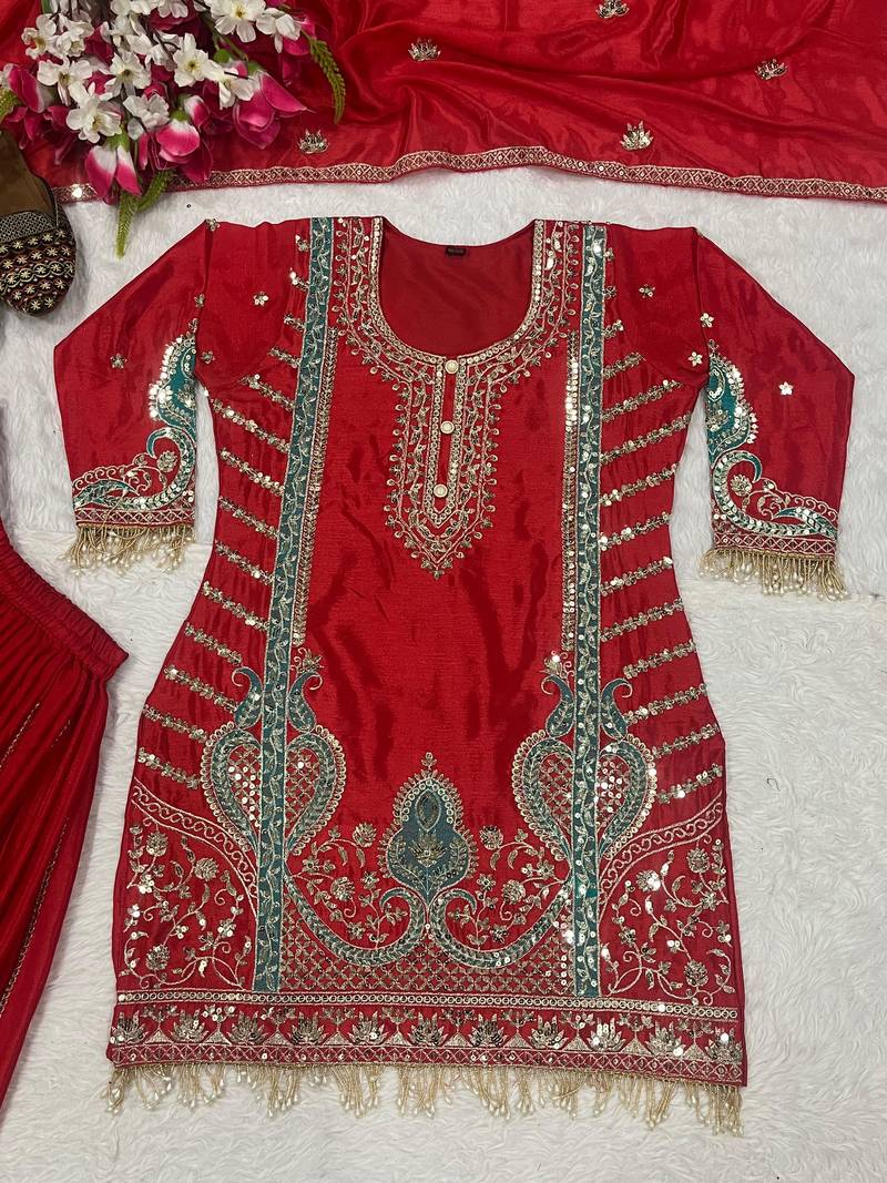 Red embroidered suit with mint green contrasts