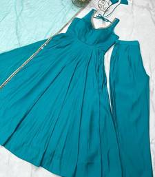 Teal blue sleeveless anarkali suit with mirror work neckline