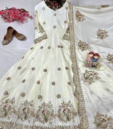 Cream anarkali gown with intricate zari embroidery