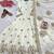 Cream anarkali gown with intricate zari embroidery