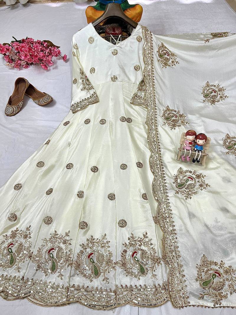 Cream anarkali gown with intricate zari embroidery