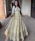 Cream anarkali gown with intricate zari embroidery