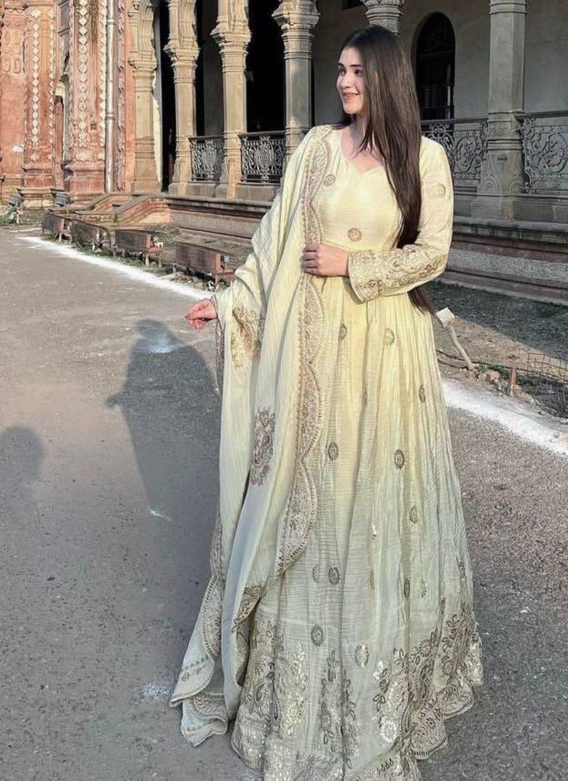 Cream anarkali gown with intricate zari embroidery