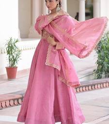 Pink silk palazzo suit with gold zari border work