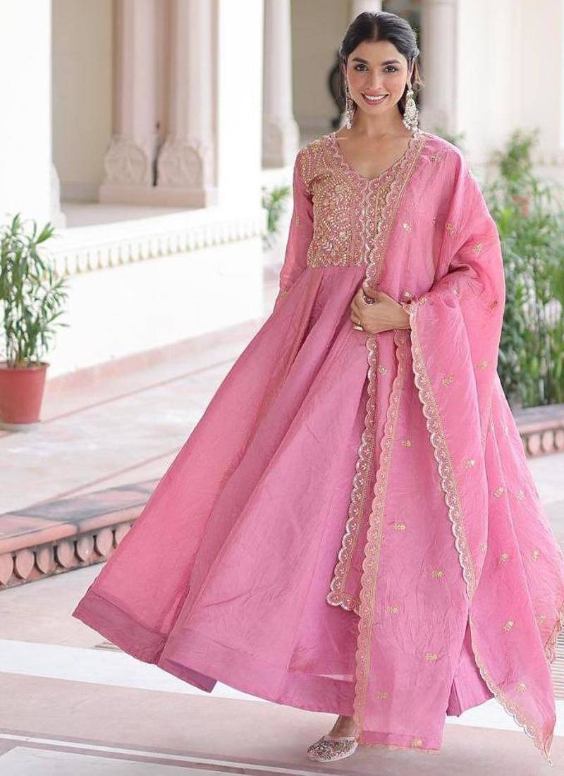 Pink silk palazzo suit with gold zari border work