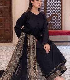 Opulent midnight black velvet suite with traditional gold tilla work