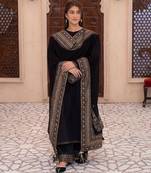 Opulent midnight black velvet suite with traditional gold tilla work