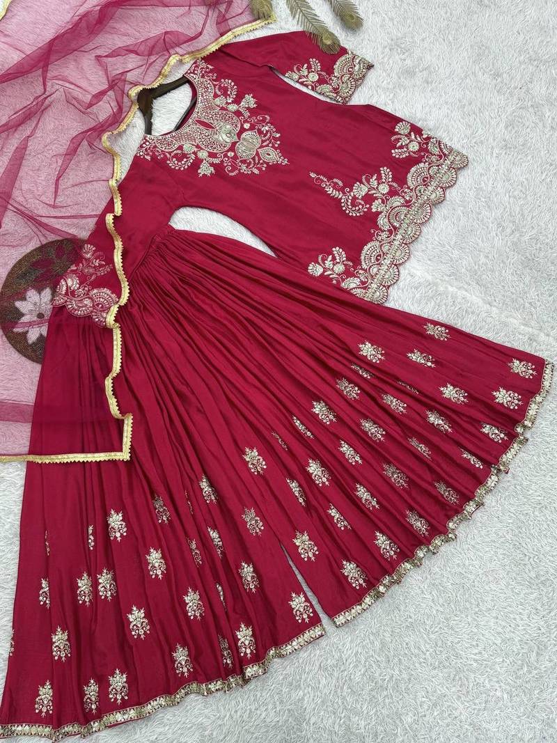 Luxurious magenta silk gharara set with traditional silver zari embroidery