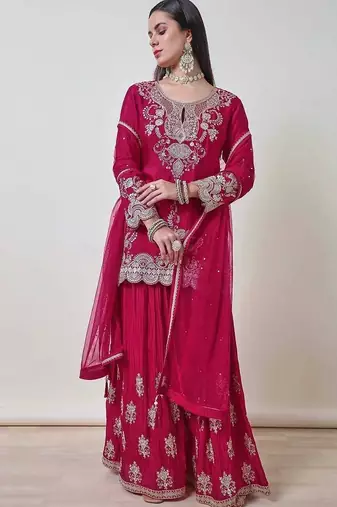 Luxurious magenta silk gharara set with traditional silver zari embroidery