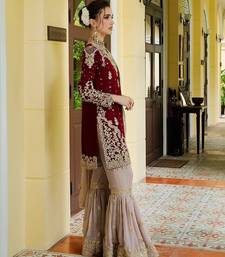 Deep maroon velvet sharara set with heavy gold tilla embroidery