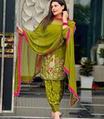 Moss green patiala salwar suit with floral threadwork and pink accents