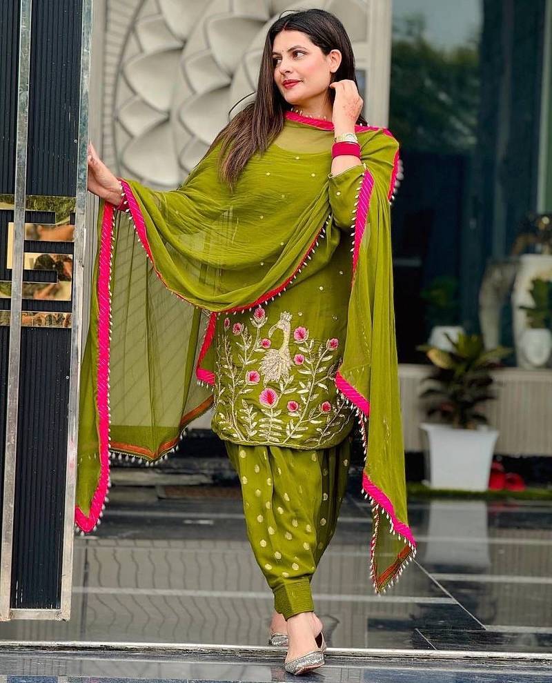 Moss green patiala salwar suit with floral threadwork and pink accents