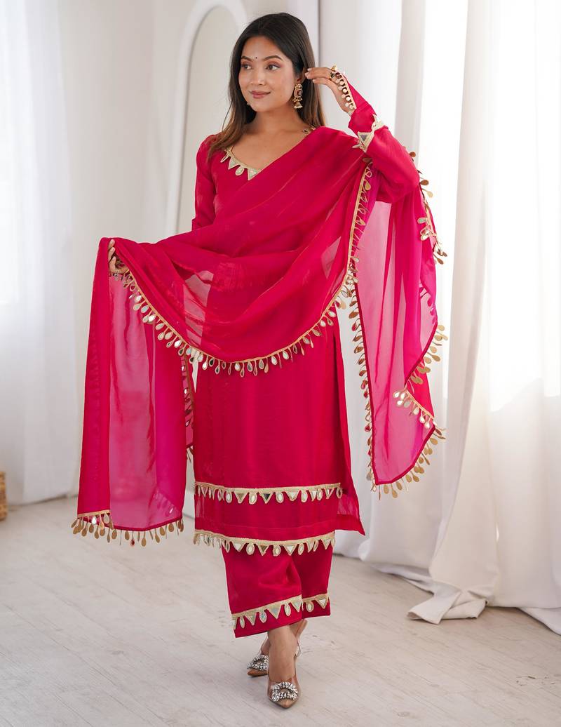 Vibrant fuchsia pink crepe salwar suit with mirror work accents