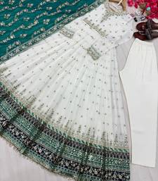 Elegant white anarkali suit with green embroidered dupatta